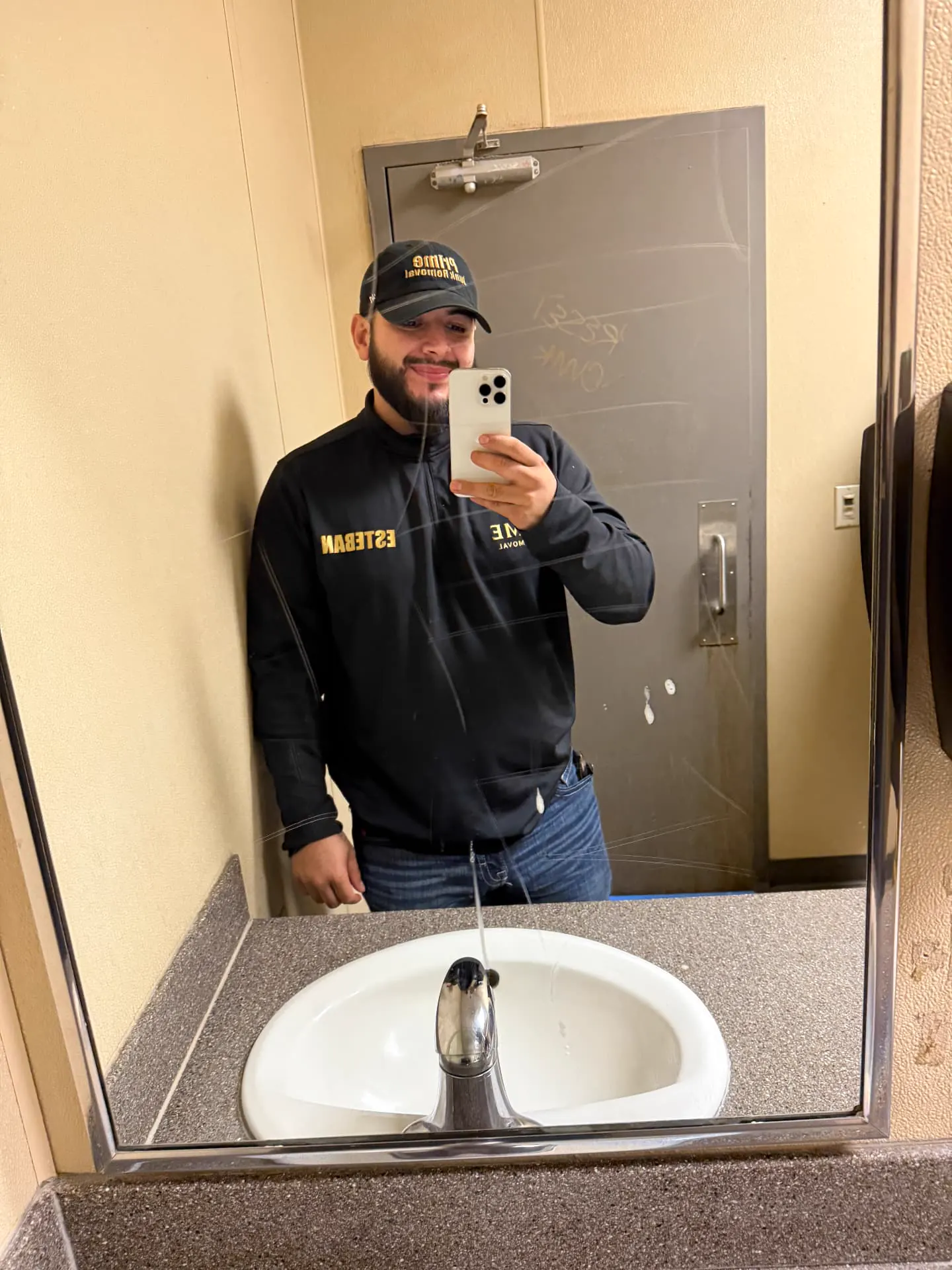 Uniformed Prime Junk Removal crew member